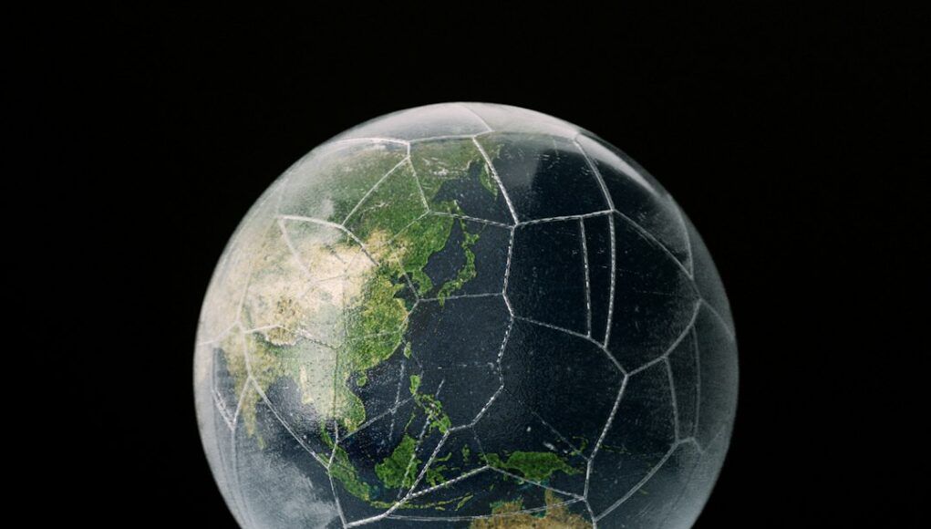 a-glass-ball-with-a-map-of-the-world-in-it-c6QH1SXGS8M.jpeg a glass ball with a map of the world in it