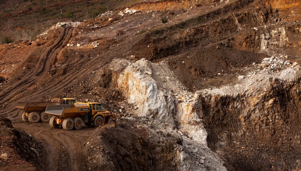 a large truck driving down a dirt road