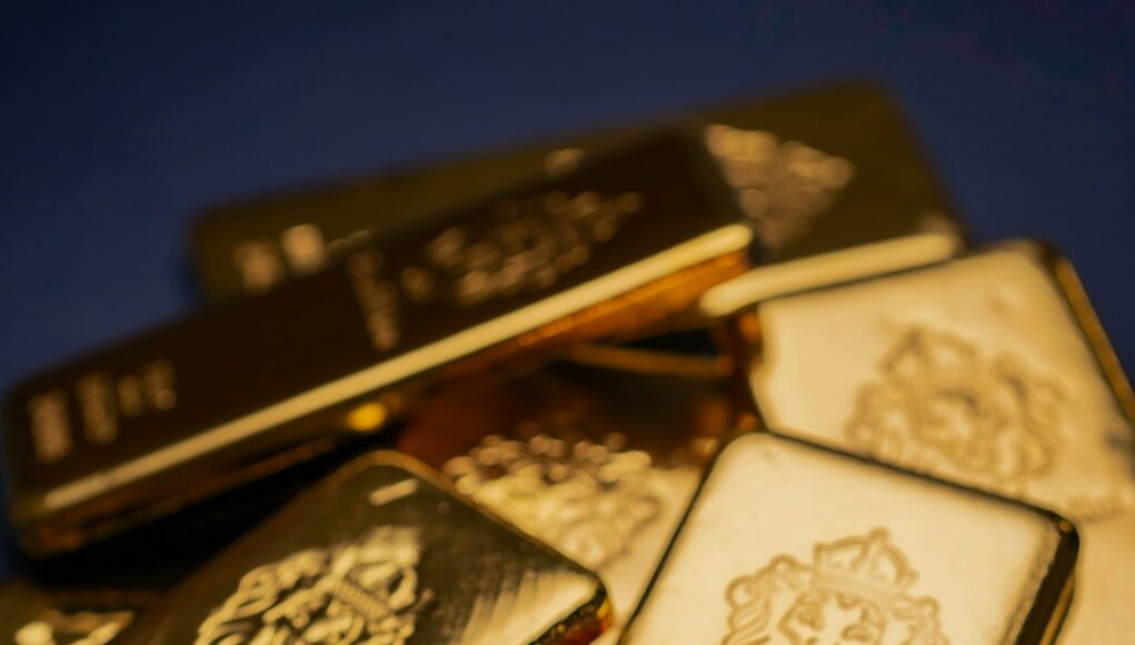 A pile of gold bars sitting on top of a table