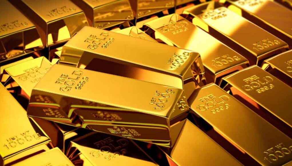 Pile of shiny gold bars stacked together, reflecting a warm light surface sheen that suggests wealth.