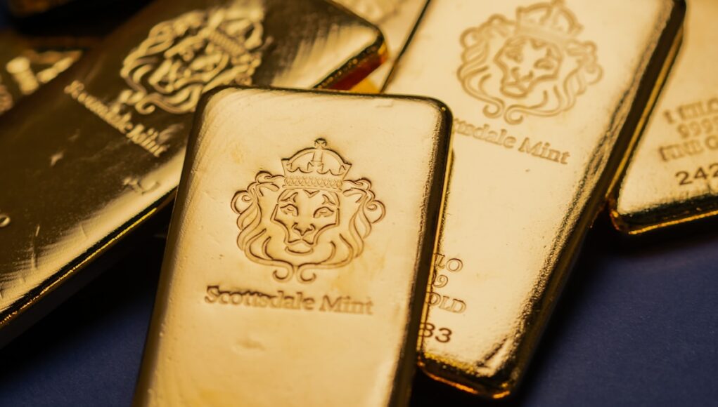 A pile of gold bars sitting on top of a table