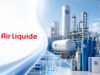 Air Liquide-Aktie: Um 165 € wieder kaufen? Air Liquide logo on the left with a blue-and-white industrial gas plant featuring tanks, pipes, and a wind turbine in the background.
