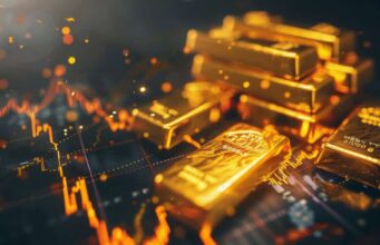 Gold: Hier könnte bald Größeres passieren! Pile of gold bars on a dark surface with glowing financial chart lines in the background.