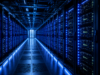 Infineon-Aktie: KI treibt Umsatz auf neues Allzeithoch Long row of server racks in a blue-lit data center, NVIDIA branding visible on the equipment.