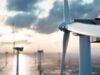 RWE-Aktie: Kursdynamik geht zurück – was ist jetzt ratsam? Offshore wind turbine at sunset with calm sea and distant turbines in the background.