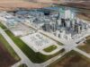 Verbio-Aktie: Ertragsprognose getoppt – was kommt jetzt? A Verbio biorefinery with numerous storage tanks and processing towers in a rural industrial site surrounded by fields.