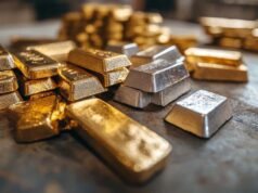 Versamet-Aktie: Ist das jetzt die perfekte Einstiegsgelegenheit? Pile of gold and silver bullion bars on a dark metal surface for storage or display (informative)