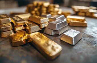 Versamet-Aktie: Ist das jetzt die perfekte Einstiegsgelegenheit? Pile of gold and silver bullion bars on a dark metal surface for storage or display (informative)