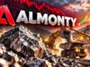 Almonty-Aktie erreicht Zielbereich: Jetzt ein Kauf? Almonty logo over a quarry with a loader dumping rocks at sunset