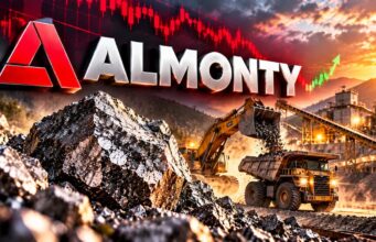 Almonty-Aktie erreicht Zielbereich: Jetzt ein Kauf? Almonty logo over a quarry with a loader dumping rocks at sunset