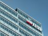 Lanxess-Aktie: Können diese Faktoren die Kurswende bringen? Modern glass office building with a LANXESS sign on the facade against a blue sky